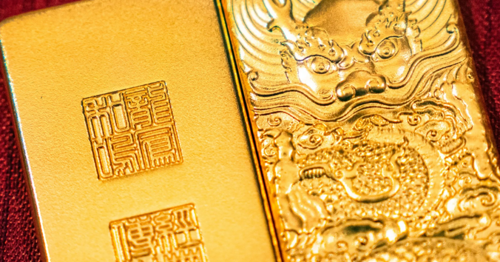 Giá vàng hồi mạnh khi giá dầu và USD quay đầu giảm, SPDR Gold Trust vẫn bán tháo
